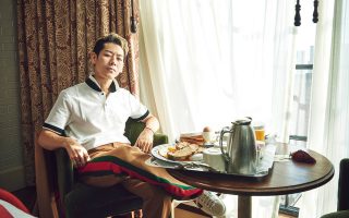 Takeru Kobiyashi sits in a hotel room with room service