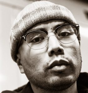 king cook looks at the camera in black and white