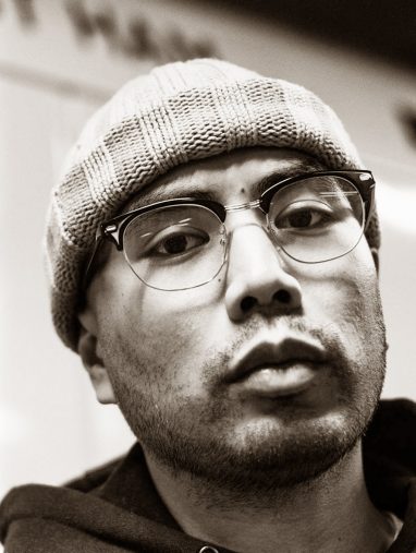 king cook looks at the camera in black and white