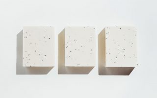 three blocks of white soap against a white background