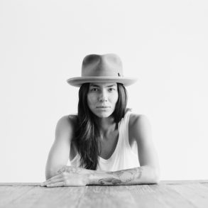 Model Tasya Van Ree sitting at a table