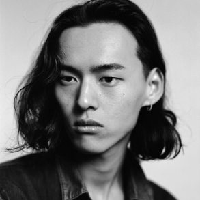 Chinese Model David Yang looks to the side in profile