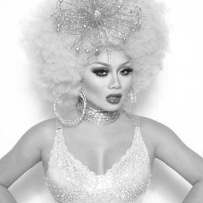 Drag queen Jujubee dressed up in glittering ensemble looks at the camera