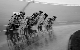black and white image of cyclists keirin