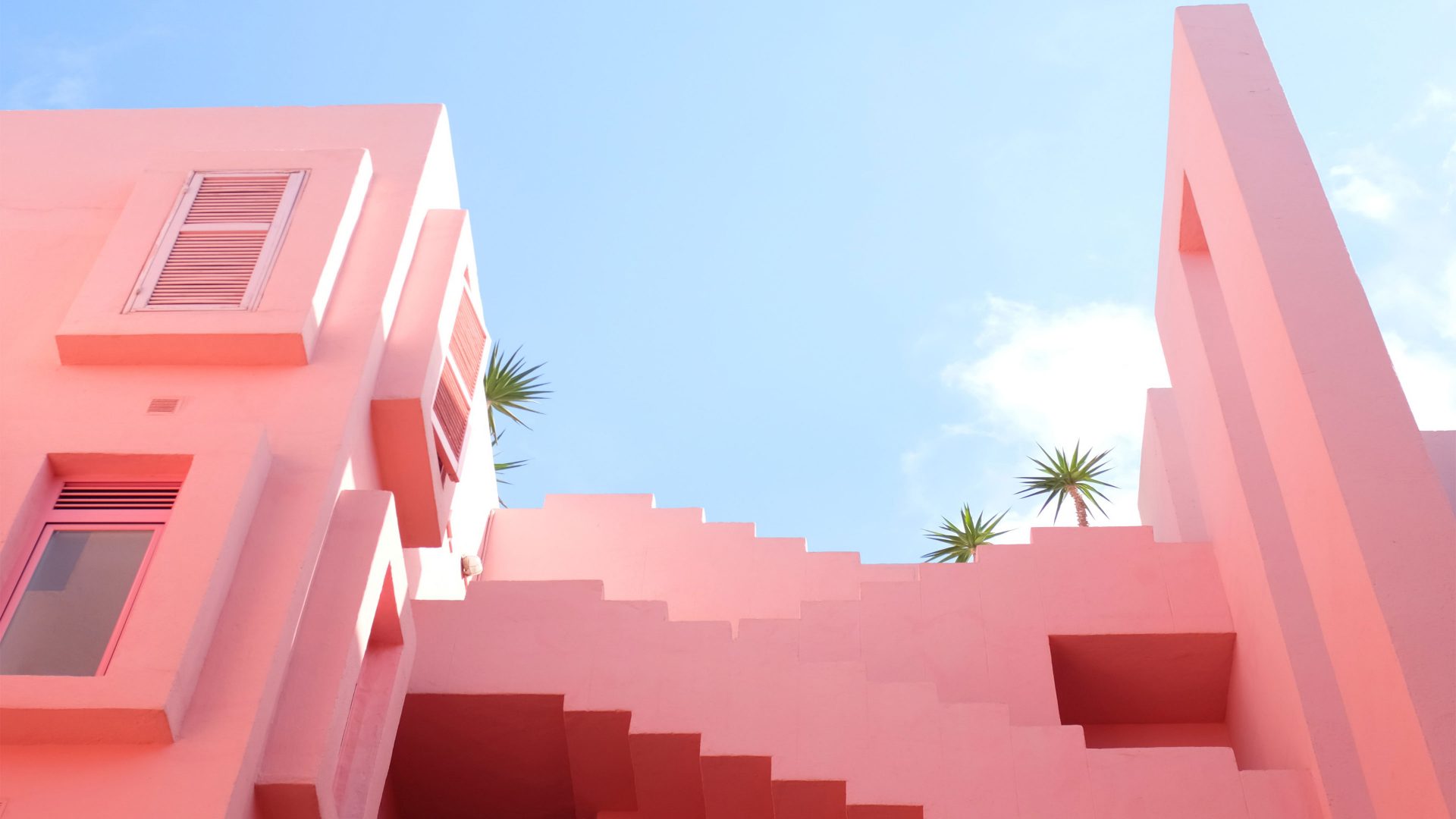 Pink buildings against a clear blue sky
