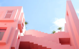 Pink buildings against a clear blue sky