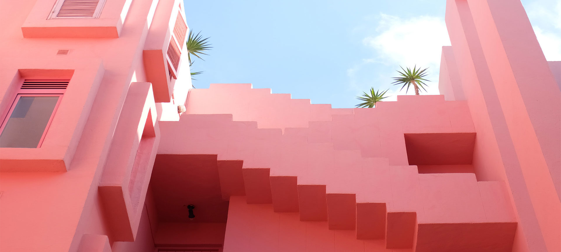 Pink buildings against a clear blue sky