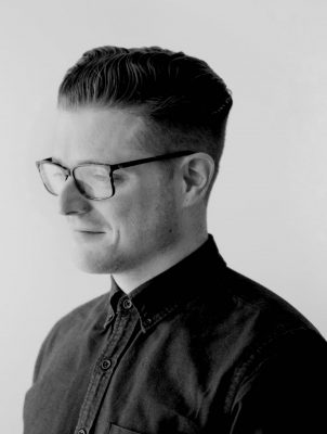 Black and white portrait of ryder carroll in shirt