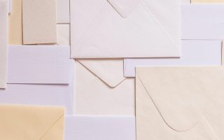 lots of white envelopes piled up