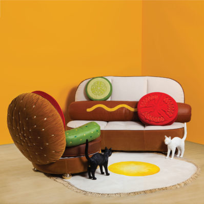 Hot dog and hamburger couches with egg print carpet