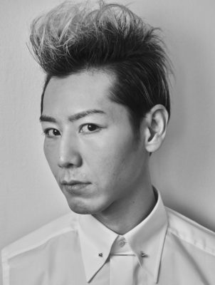 Kobayashi wearing a white shirt