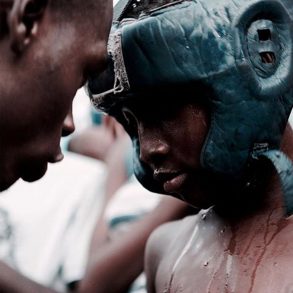 A young Bukom boxer with coach