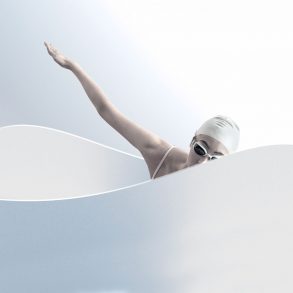 A female model poses as a swimmer in a white tub