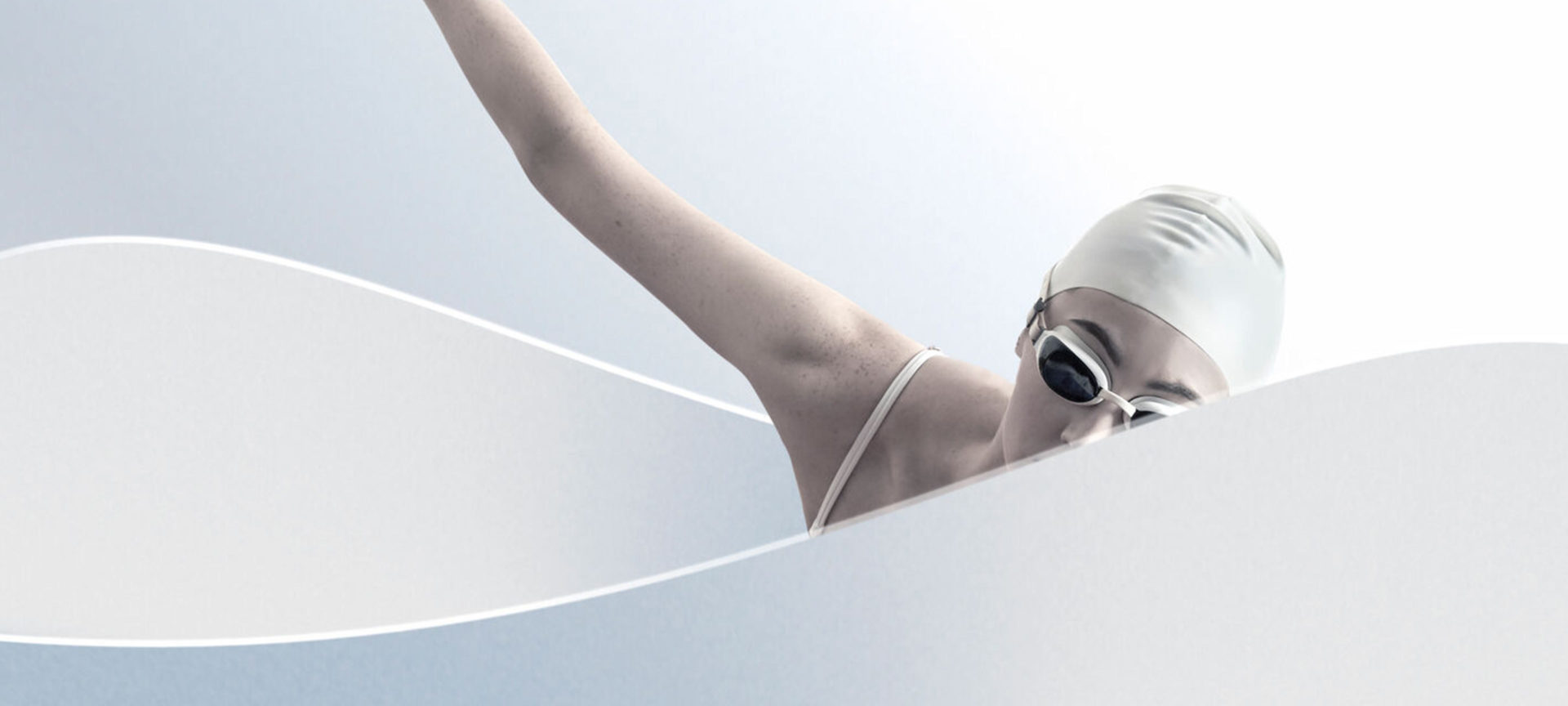 A female model poses as a swimmer in a white tub