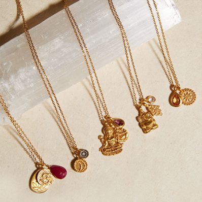 gold jewellery on beige cloth