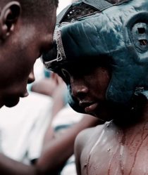 Young bukom boxer with coach