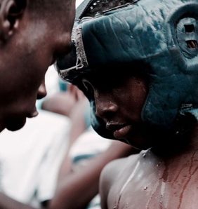 Young bukom boxer with coach