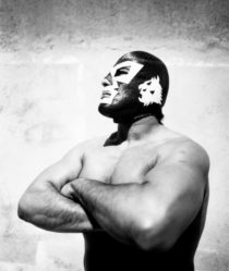 black and white image of a mexican wrestler