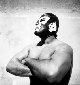 black and white image of a mexican wrestler