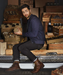Fine food sourcer Ian Purkayastha sits in a van with crates of wine and truffles