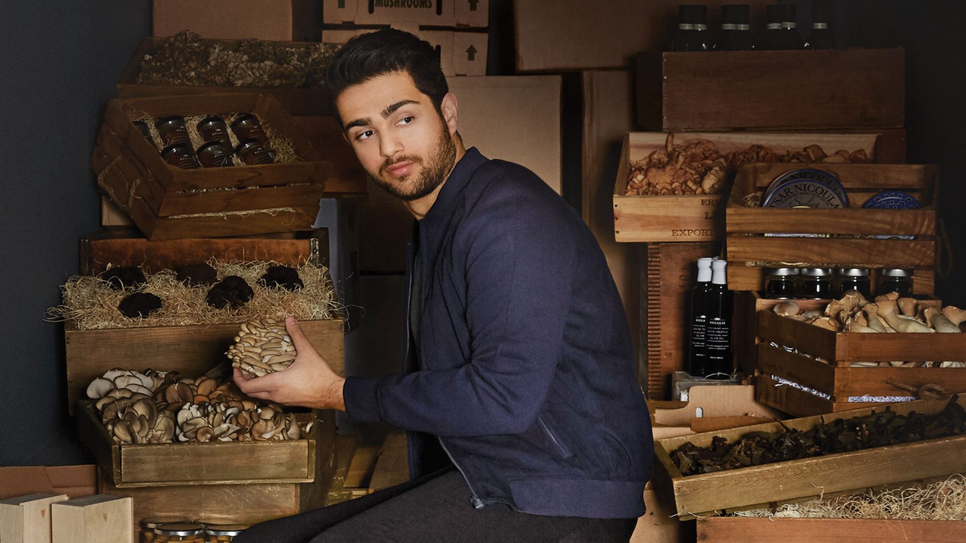 Fine food sourcer Ian Purkayastha sits in a van with crates of wine and truffles