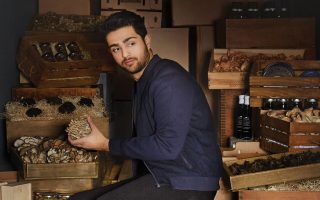 Fine food sourcer Ian Purkayastha sits in a van with crates of wine and truffles