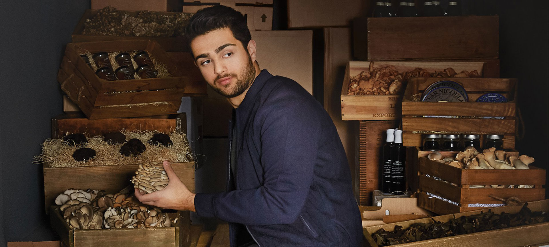 Fine food sourcer Ian Purkayastha sits in a van with crates of wine and truffles