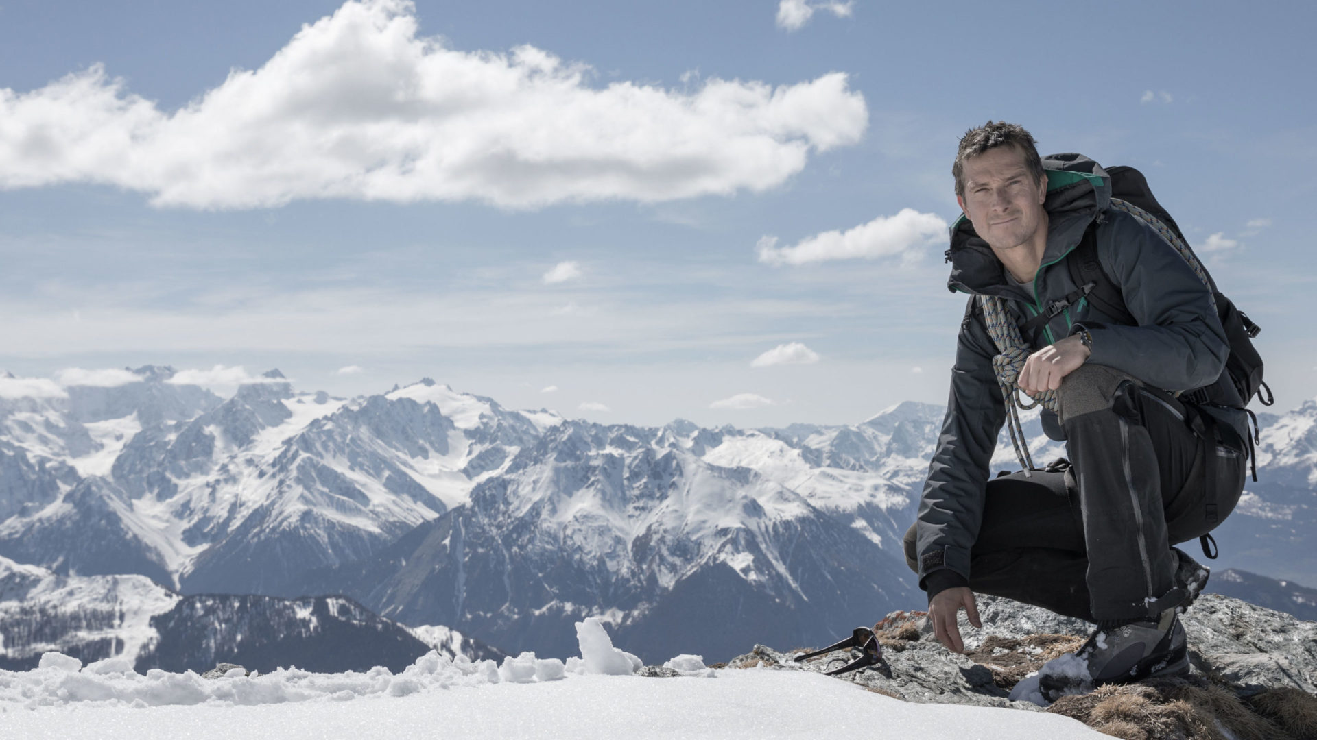 Adventurer Bear Grylls on top of a mountain