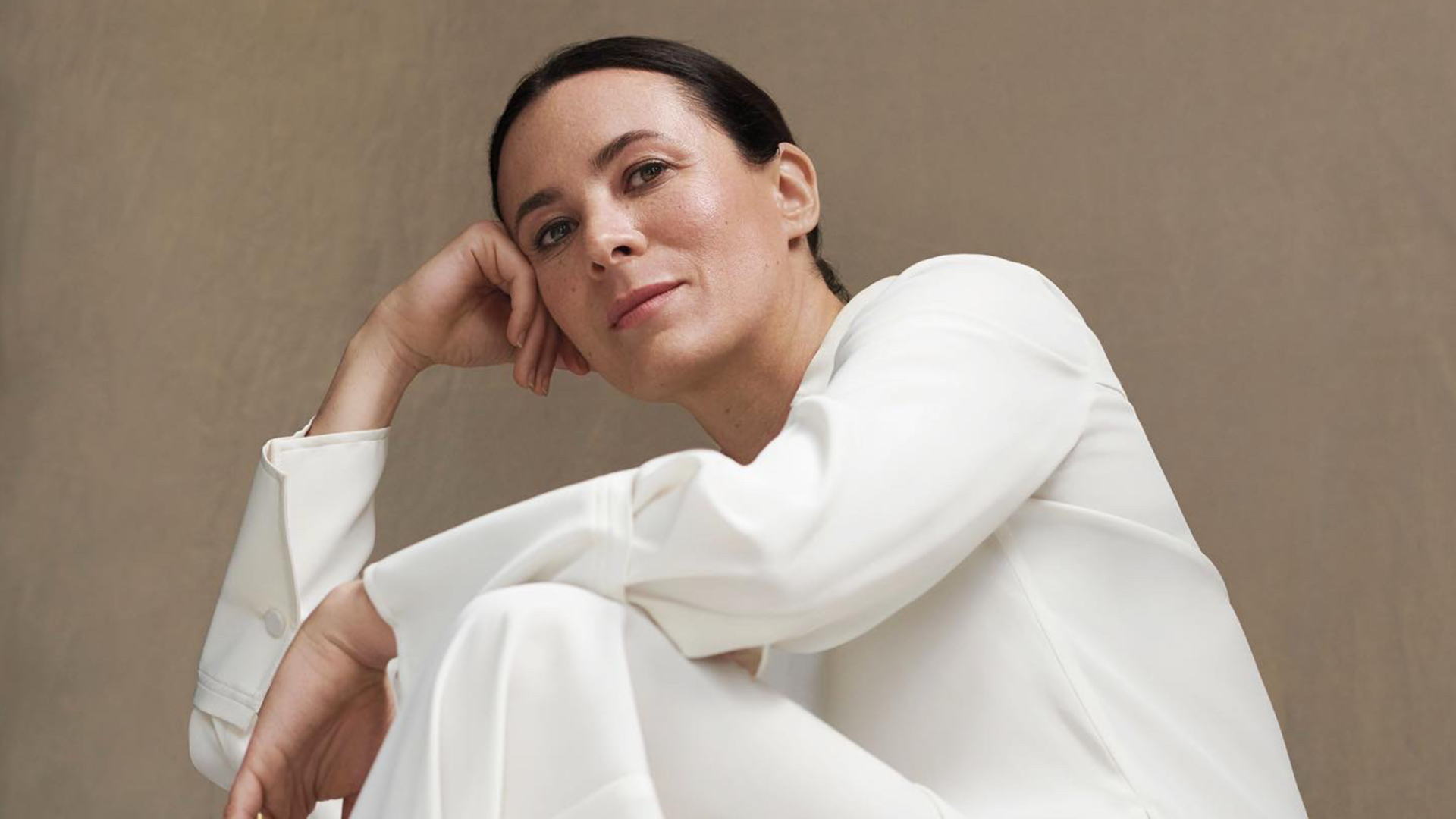 style influencer garance dore poses with handbag for interview