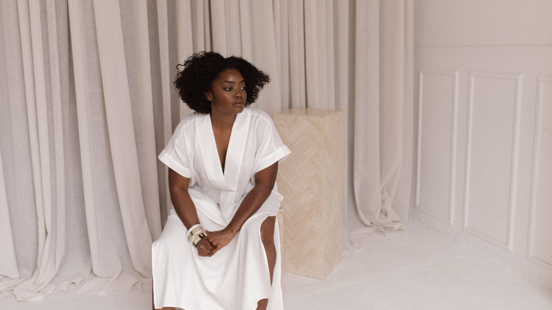 Interior designer Nike Onile poses in the studio