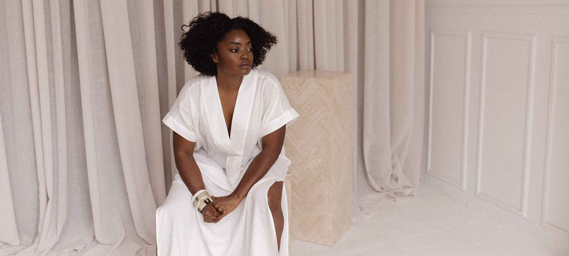 Interior designer Nike Onile poses in the studio